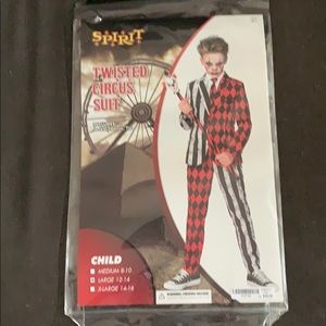 Includes pants, jacket, tie and cane.